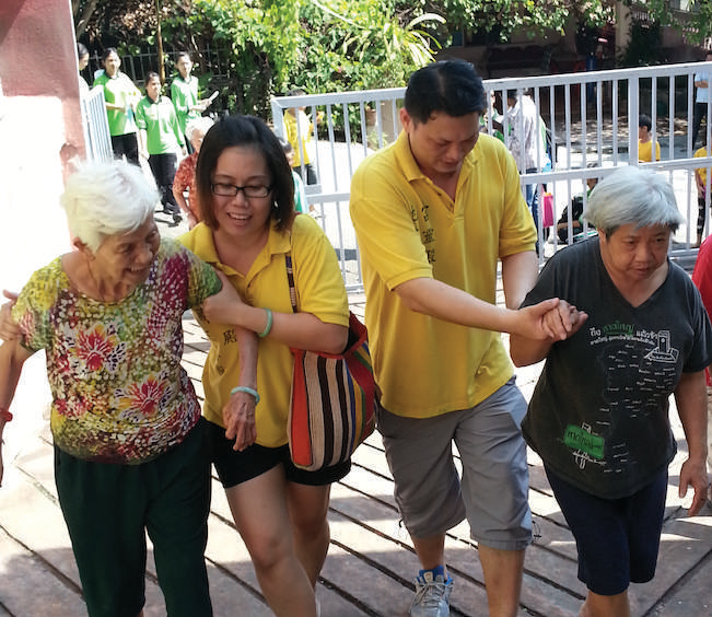 FLD volunteers accompanying older people outdoors